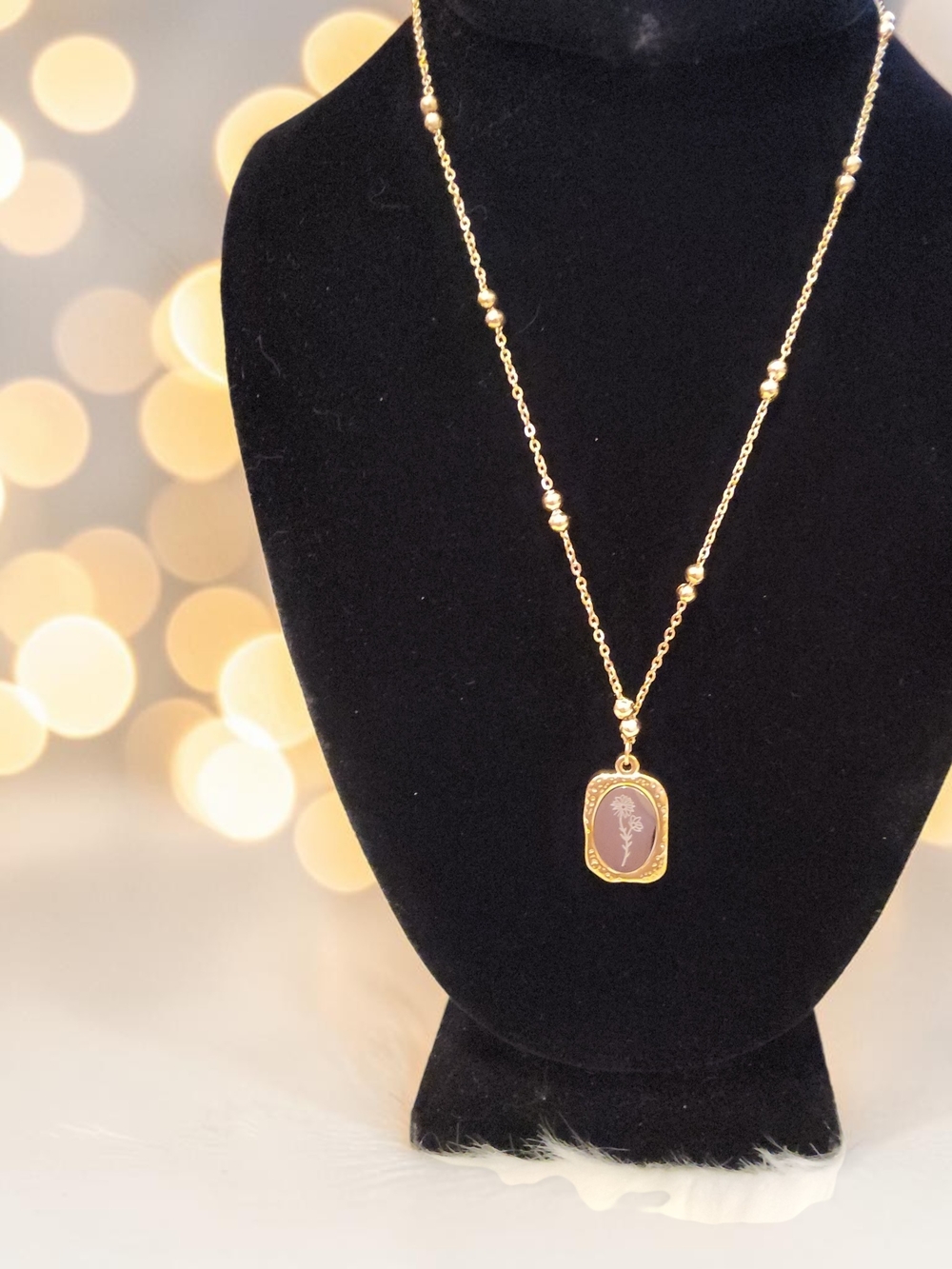 Plunder Gold-Tone Necklace with Silver Flower Design
